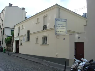 Devanture de Garage Claude Porte Doree.